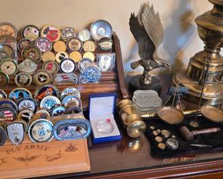 Military challenge coins and displays, office to the left as you enter the front door.