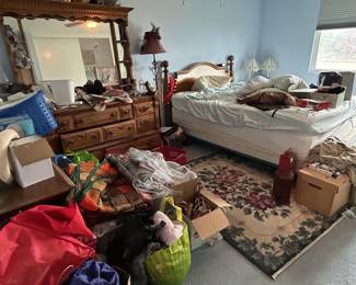 The primary bedroom before and after Heritage staging.