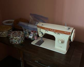 Singer sewing machine and notions.