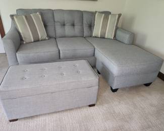 Light gray and aqua sofa with chaise and storage ottoman