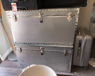 Two Metal Trunks and black Lugggage