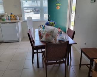 Dining table and 4 chairs with folding extensions on table