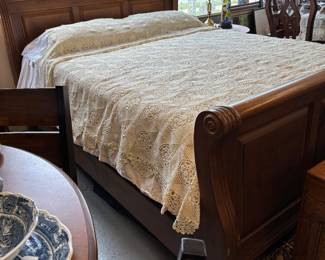 Beautiful Queen Size Sleigh Bed. Crocheted bedspread or tablecloth. Excellent condition.