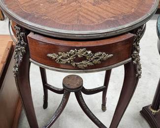 European style inlaid wood table with applied metal decoration.