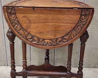 Ornate drop leaf side table