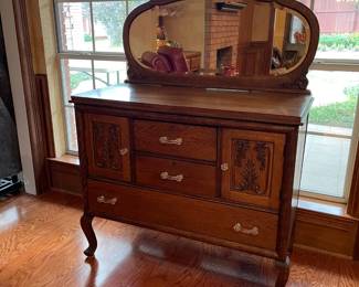 Wonderful English tiger oak buffet with oval mirror and glass knobs
