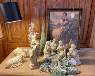 This Nativity was made in Red River New Mexico by a local artisan and is just beautiful, sheep art in the background and trees