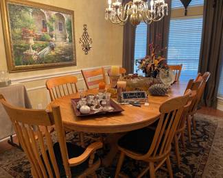 Wonderful oval dining table measures 110" long with leaf and 48" wide and can seat 12 people a great find and comes with 8 chairs