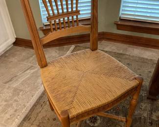 Showing the wheat back, rush seat chair, we have four of these chairs