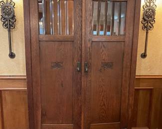English wardrobe with beveled glass panels at the top of the doors