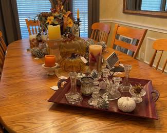 Looking down the table, glass candle sticks and votive pieces, candles