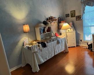 2nd bedroom full of vintage linens, children's books and toys