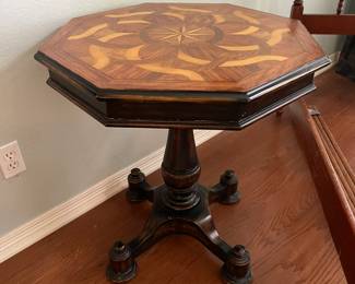 Eight sided accent table with mixed wood inlay top