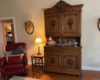 Antique French walnut buffet, cranberry leather reclining chair