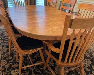Oval dining table can seat 12 people.