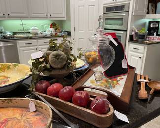 Faux fruit arrangement, glass, hand embroidered wood tray, and fruit