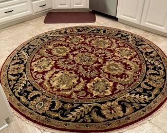 New round 6ft hand knotted, burgundy/tan/black rug with pad