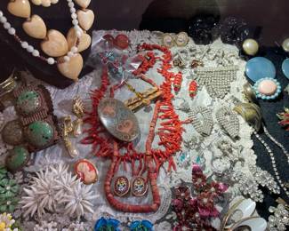 A closer look at the jewelry, branch coral, coral beads, rhinestones, great vintage earrings and bone