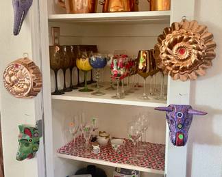 Copper, masks, and wine glasses