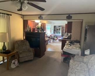 Entertainment cabinet. Recliner. Lamp. Side table.