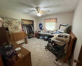 Bed with mattress, exercise bike, household items