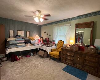 Holiday decor, blankets, pillows, towels, and vintage yellow chair.