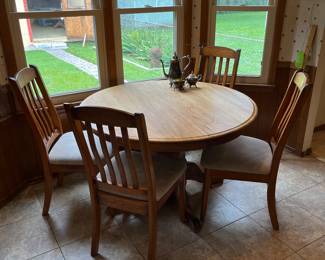 Round dining table and four chairs.