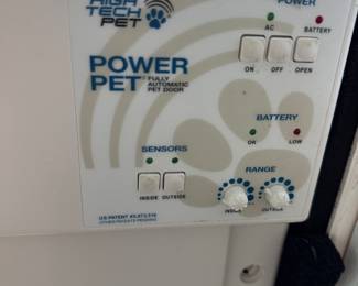 High tec pet automatic door (this fits into a patio door and allows the dog to open and close the door with a collar )