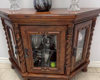 Ornate small curio cabinet