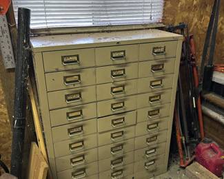 Metal cabinet with drawers.