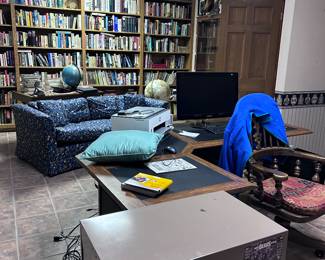 Office desk. File cabinet. Books.