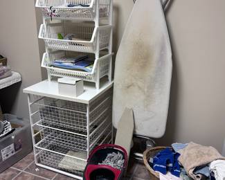 Ironing board. Storage bins. Mop.