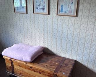 Cedar chest. Linens. Wall art.