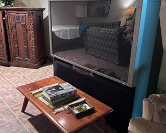 Large television. MCM coffee table.