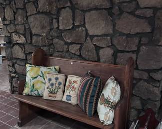 Church pew. Pillows. Magazine rack.