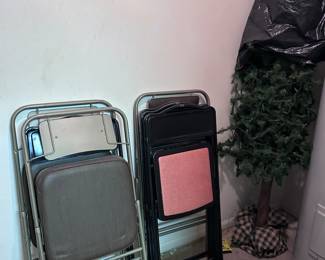 Folding chairs. Christmas trees.