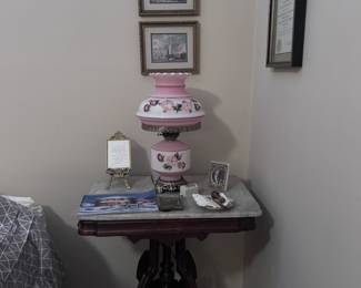 Antique side table. Antique glass lamp.