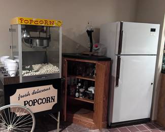 Popcorm machine. Corner cabinet. Refrigerator.