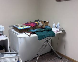 Chest freezer. Ironing board. Laundry room items.