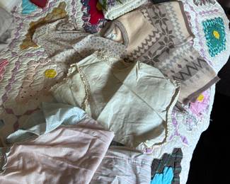 Vintage clothing and quilt.