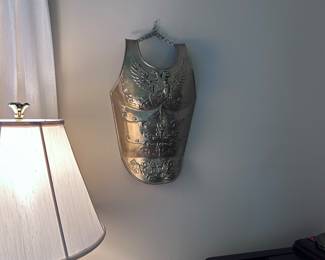 Brass shield.