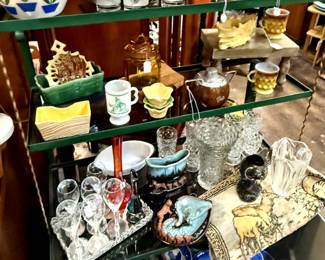 1950's shelf with Glassware, Tapestry , Pitchers, and Vases.
