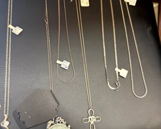 Sterling A&M cross necklace, Asian pendant on Sterling chain, multiple sterling chains.