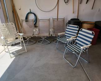 3 matching rocking outdoor chairs, 2 matching chairs, 2 more outside folding chairs.