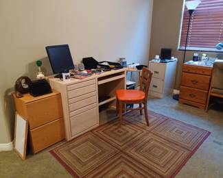 2 desks, 2 chairs, 2 file cabinets, older computer - good for playing games, assortment of office supplies. Area rug is also available.