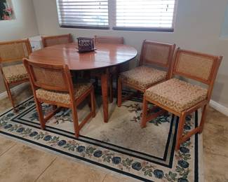 Kitchen table and 6 padded chairs. Includes 2 table extenders. Area rug is also available.