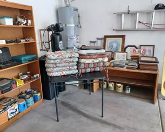 Several chair pads, picture frames - several sizes, clocks, pictures, many tools on the shelve. Card table also for sale.
