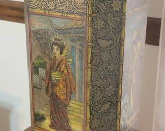Close up of tin base Asian style lamp