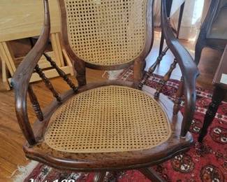 Antique cane seat Eastlake design office chair