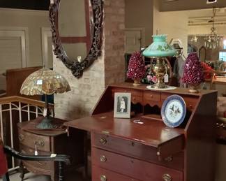 Vintage mirror and antique slant front desk
